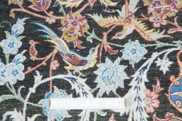 Backside of handmade New Isfahan rug showing knot structure and weave density