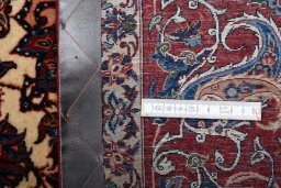 Surface texture of 1930s Isfahan rug with natural Wool and intricate pattern