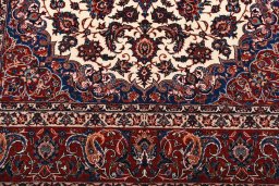 Backside of handmade 1930s Isfahan rug showing knot structure and weave density
