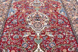 Backside of handmade New Isfahan rug showing knot structure and weave density