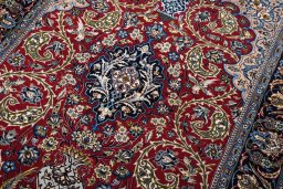 Backside of handmade New Isfahan rug showing knot structure and weave density