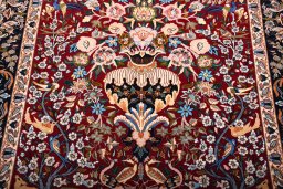 Backside of handmade New Isfahan rug showing knot structure and weave density