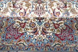 Surface texture of 2000s Isfahan rug with natural Cork and intricate pattern