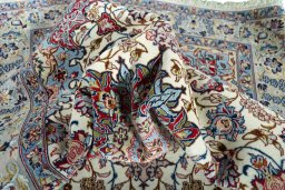 Backside of handmade 2000s Isfahan rug showing knot structure and weave density