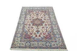 Surface texture of 2000s Isfahan rug with natural Cork and intricate pattern