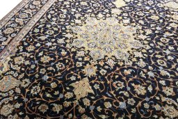 Backside of handmade 2000s Isfahan rug showing knot structure and weave density