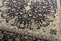 Close-up detail of 2000s Isfahan rug from Iran / Persia showing Wool weave