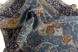 Surface texture of 1950s Isfahan rug with natural Cork and intricate pattern