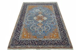 Surface texture of 1950s Isfahan rug with natural Cork and intricate pattern