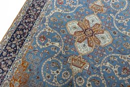 Backside of handmade 1950s Isfahan rug showing knot structure and weave density