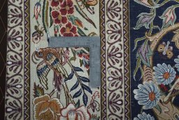 Backside of handmade New Isfahan rug showing knot structure and weave density