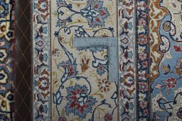 Backside of handmade 1970s Isfahan rug showing knot structure and weave density
