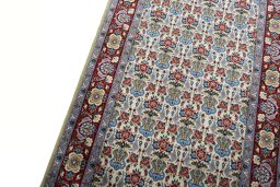 Backside of handmade New Isfahan rug showing knot structure and weave density