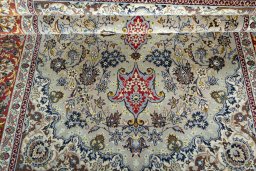 Surface texture of 2000s Isfahan rug with natural Cork and intricate pattern