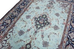 Backside of handmade New Isfahan rug showing knot structure and weave density