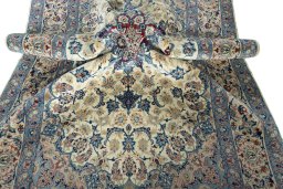 Surface texture of 2000s Isfahan rug with natural Cork and intricate pattern