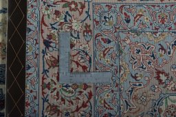 Backside of handmade 2000s Isfahan rug showing knot structure and weave density