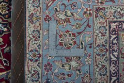 Backside of handmade 1970s Isfahan rug showing knot structure and weave density