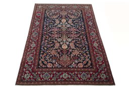 Surface texture of 1930s Isfahan rug with natural Wool and intricate pattern