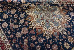 Surface texture of 1950s Isfahan rug with natural Cork and intricate pattern