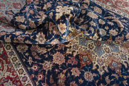 Backside of handmade 1950s Isfahan rug showing knot structure and weave density