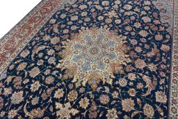 Backside of handmade 1950s Isfahan rug showing knot structure and weave density
