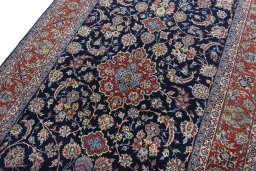 Backside of handmade New Isfahan rug showing knot structure and weave density