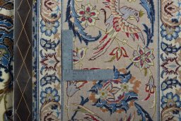 Backside of handmade 2000s Isfahan rug showing knot structure and weave density