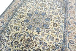 Backside of handmade 2000s Isfahan rug showing knot structure and weave density