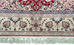 Full view of 1970s Isfahan rug from Iran / Persia, 220 × 153 cm in Red tones