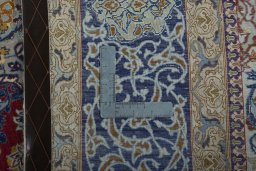 Backside of handmade 1970s Isfahan rug showing knot structure and weave density