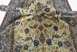 Surface texture of 1950s Isfahan rug with natural Cork and intricate pattern