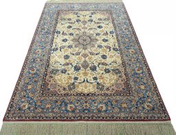 Surface texture of 1950s Isfahan rug with natural Cork and intricate pattern