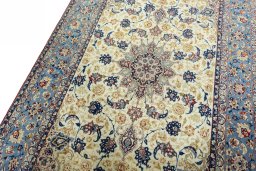 Backside of handmade 1950s Isfahan rug showing knot structure and weave density