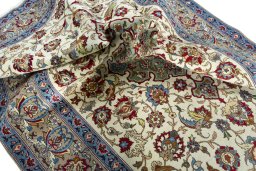 Surface texture of 1950s Isfahan rug with natural Wool and intricate pattern
