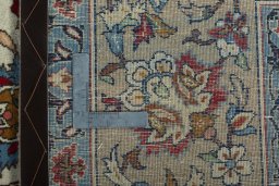 Backside of handmade 1950s Isfahan rug showing knot structure and weave density