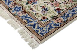Backside of handmade New Isfahan rug showing knot structure and weave density