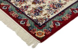 Backside of handmade New Isfahan rug showing knot structure and weave density