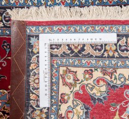 Corner detail of New Isfahan rug showing border pattern and Wool pile