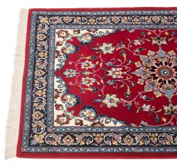 Backside of handmade New Isfahan rug showing knot structure and weave density