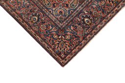 Backside of handmade 1920s Kashan rug showing knot structure and weave density