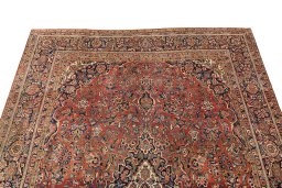 Backside of handmade 1950s Kashan rug showing knot structure and weave density