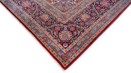 Backside of handmade New Kashan rug showing knot structure and weave density