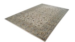Corner detail of New Kashan rug showing border pattern and Wool pile