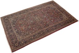 Corner detail of New Kashan rug showing border pattern and Wool pile