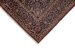 Backside of handmade New Kashan rug showing knot structure and weave density