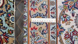 Corner detail of 1980s Kashan rug showing border pattern and Wool pile