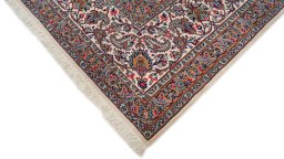 Backside of handmade 1980s Kashan rug showing knot structure and weave density