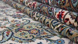 Full view of 1980s Kashan rug from Iran / Persia, 489 × 342 cm in Cream tones