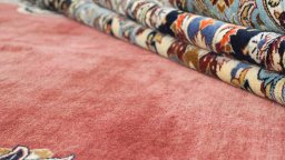 Backside of handmade 1980s Kashan rug showing knot structure and weave density